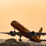 airplane-taking-off-sunset