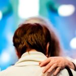 man-woman-concert-hug