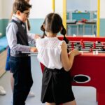 teenagers-playing-foosball
