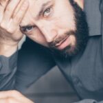 man-looking-smartphone-confused