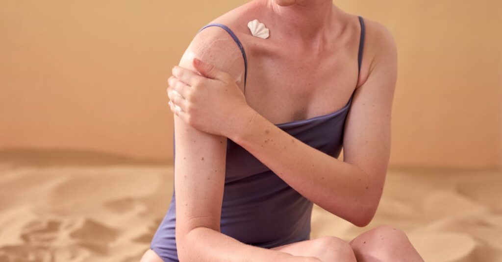 woman-applying-sunscreen-face