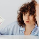young-woman-thinking-money