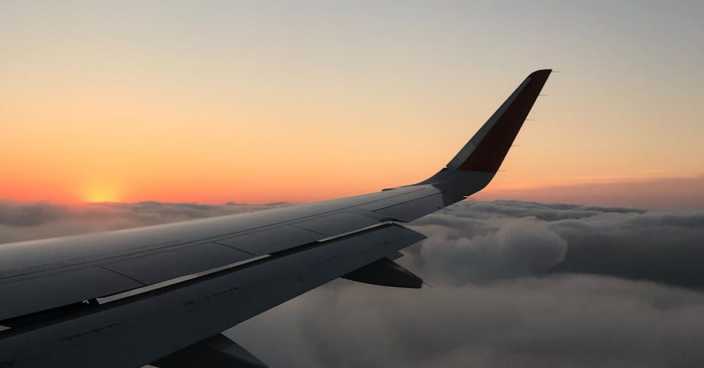 airplane-flying-sunset