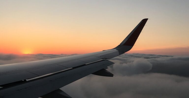 airplane-flying-sunset