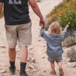 child-walking-with-parent