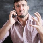 man-looking-phone-anxious